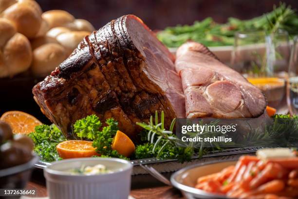 glazed spiral cut easter ham dinner - easter dinner stock pictures, royalty-free photos & images