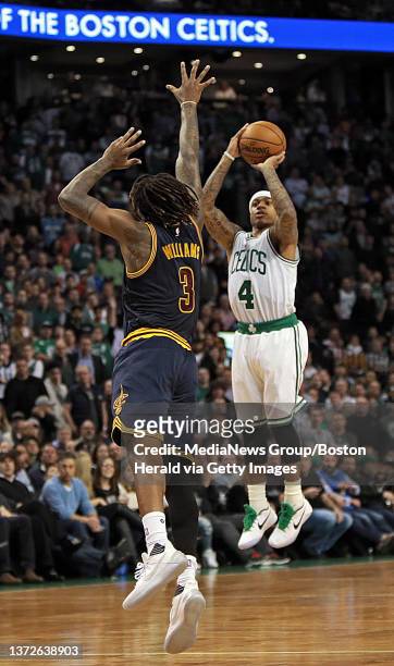 Boston Celtics guard Isaiah Thomas hits the game winning basket over the head of Cleveland Cavaliers forward Derrick Williams at the end of the...