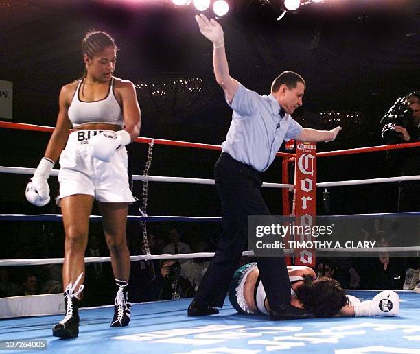 Laila Ali of Los Angeles and daughter of boxing legend Muhammad Ali walks away after her knock out Christine Robinson of Lexington, KY, in the fifth...