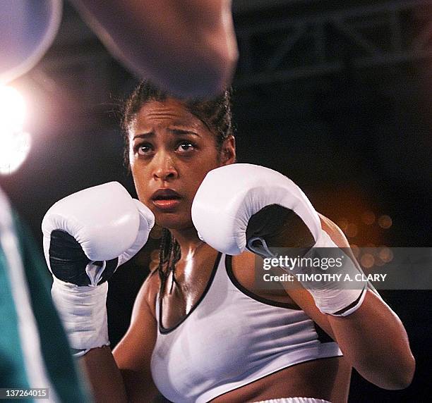 Laila Ali of Los Angeles and daughter of boxing great Muhammad AlI keeps her hands up during her six-round bout with Christine Robinson of Lexington,...