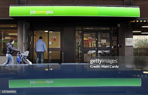 People enter the Jobcentre Plus office on January 18, 2012 in Bath, England. Figures released today show that the UK unemployment rate has risen to a...