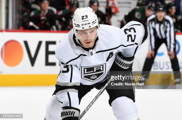 Dustin Brown of the Los Angeles Kings gets ready during a face off against the Arizona Coyotes at Gila River Arena on February 23, 2022 in Glendale,...