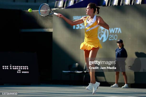 Chloe Paquet of France hits a forehand during a match between Chloe Paquet of France and Sloane Stephens of United States as part of day 4 of the...