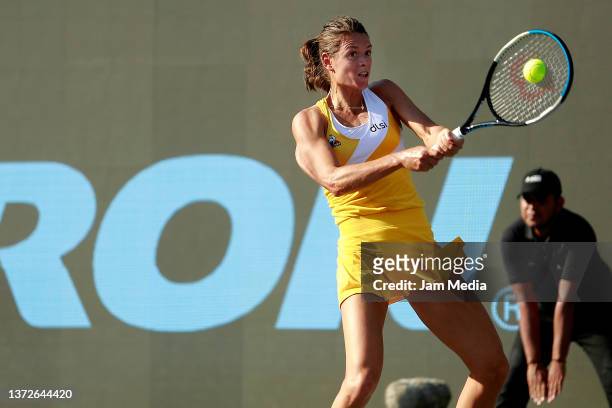 Chloe Paquet of France hits a backhand during a match between Chloe Paquet of France and Sloane Stephens of United States as part of day 4 of the...