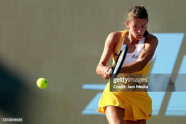 Chloe Paquet of France hits a backhand during a match between Chloe Paquet of France and Sloane Stephens of United States as part of day 4 of the...