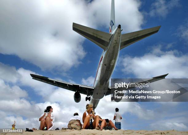 Crowds gather on Maho Beach to greet low flying arrivals to princess Juliana Airport