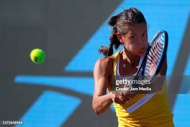 Chloe Paquet of France hits a backhand during a match between Chloe Paquet of France and Sloane Stephens of United States as part of day 4 of the...