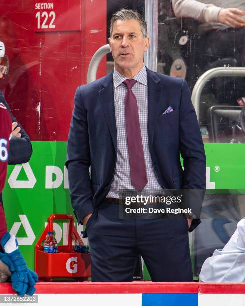 Head Coach Jared Bednar of the Colorado Avalanche watches the play from the bench during the first period of an NHL game at Little Caesars Arena on...