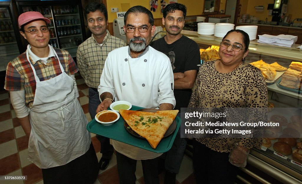 (030508WoburnMA)To go with Real Estate profile of Woburn. Hot Breads staff Amina(no 2nd name given)Muthuraj Meikannan, manager, Patrick Menezes,chef, holding Mysore Masala Dosa, Annu Jayakrisna, chef, and Swapna(no 2nd name given) in the store. (