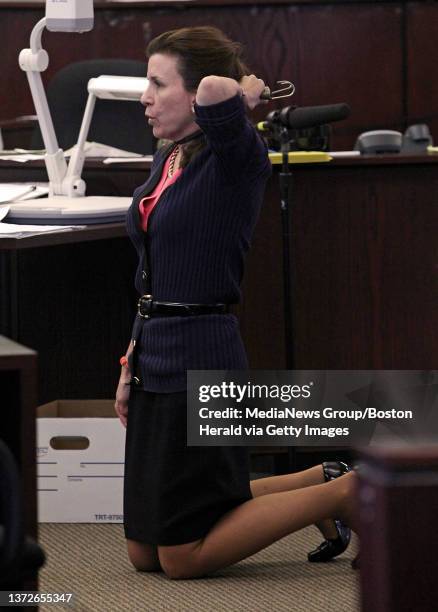 Prosecutor Lisa McGovern holds a bungee cord around her neck to demonstrate how Lauren Astley was killed during closing arguments in the Nathaniel...