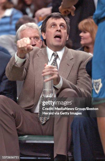 Former Boston Celtic Kevin McHale talks to a Minnesota Timberwolve player during the first half at the Fleet Center, 03/06/05 in Boston.