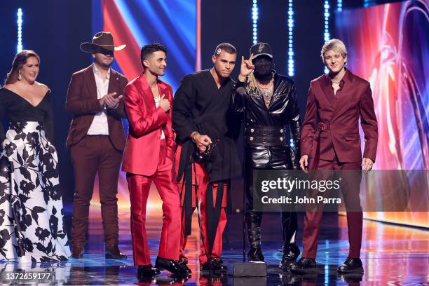 Angélica Vale, Edén Muñoz, and Erick Brian Colón, Zabdiel De Jesús, Richard Camacho, and Christopher Vélez of CNCO speak onstage during Univision's...