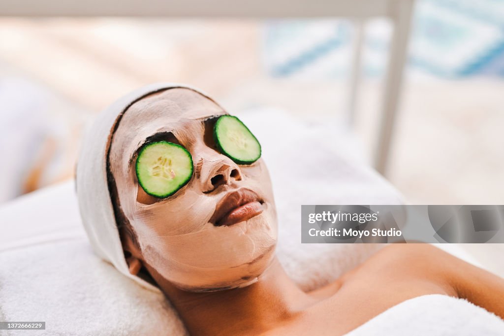 Shot of an attractive young woman getting a facial at a beauty spa