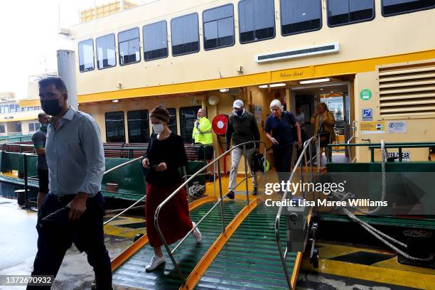 People disembark a public ferry at Circular Quay on February 25, 2022 in Sydney, Australia. Across New South Wales COVID-19 restrictions will be ease...