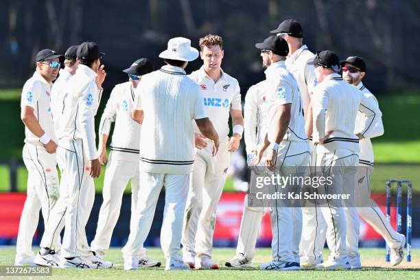 Matt Henry of New Zealand is congratulated by team mates after dismissing Sarel Erwee of South Africa during day one of the Second Test Match in the...