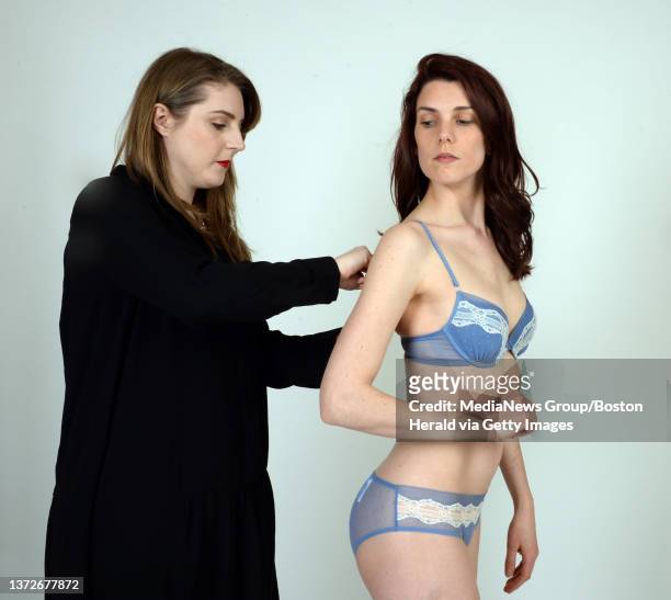 ( Boston, MA 03/08/16 Jessie Elliot, Assistant Store Manager at Rigby & Peller Boston Copley Place adjusts an Andres Sarda Milano ensemble in penguin...