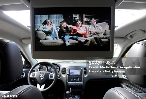 Rear DVD system in the 2012 Dodge Durango Citadel AWD sport utility vehicle which drops down from the headliner is seen on Friday, March 09, 2012....