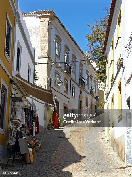 cobblestone street in pittoresque silves - silves portugal stock pictures, royalty-free photos & images
