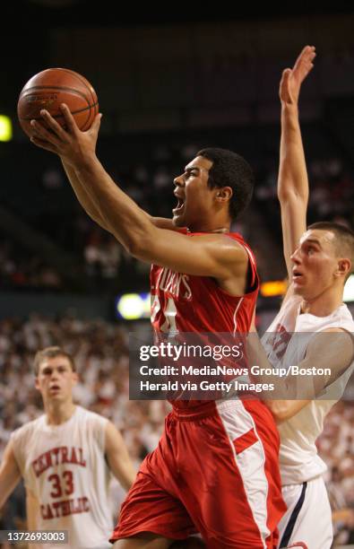 Boys Division 1, Central Catholic vs. Saint John's. St. John's Richard Rodgers shoots past CC's Carson Desrosiers in the second quarter. Saturday,...