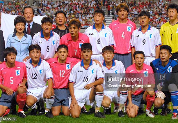 South and North Korean national soccer team players pose for photographers betore their friendly game for the unification of both Koreas September 7,...