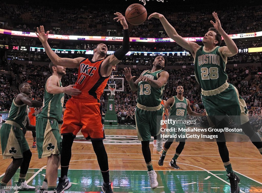 (Boston, MA, 03/16/16) Boston Celtics center Tyler Zeller, guard James Young and guard R.J. Hunter try to rebound away from Oklahoma City Thunder center Enes Kanter during the second half of the NBA game at the TD Garden on Wednesday, March 16, 2016