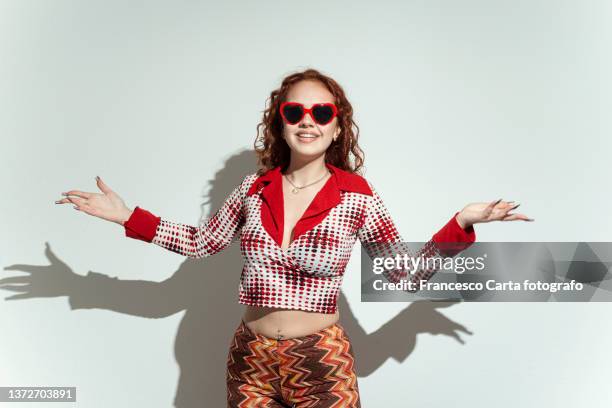 woman having fun with eccentric clothing - manufactured object stock pictures, royalty-free photos & images