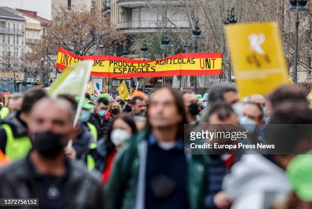 Several people with a Spanish flag that reads 'Consume Spanish products', in a rally for the "survival" of the Valencian countryside, in the Plaza...
