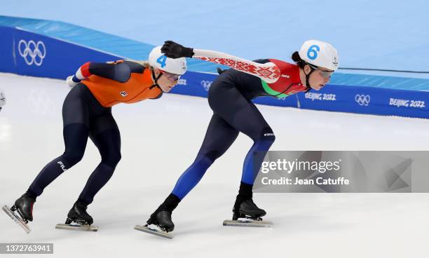 Marijke Groenewoud of Netherlands, Marina Zuyeva of Belarus during the Women's Mass Start Speed Skating on day fifteen of the Beijing 2022 Winter...