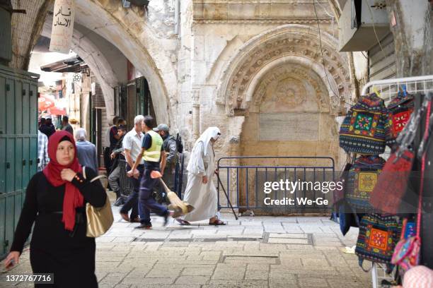 traditional bazaar in the muslim quarter of jerusalem - jerusalem stock pictures, royalty-free photos & images