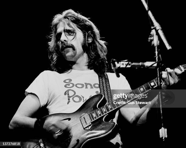 Glenn Frey of the Eagles performs on stage at Wembley Empire Pool, London, 26 April 1977. He plays a Gibson ES-330 guitar.