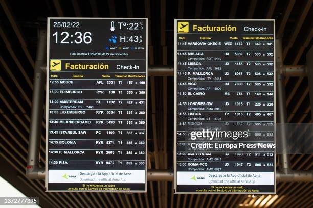 Two screens showing a flight to Moscow at Terminal 1 of Adolfo Suarez Madrid Barajas Airport on the day Russia announced restrictions on its airspace...