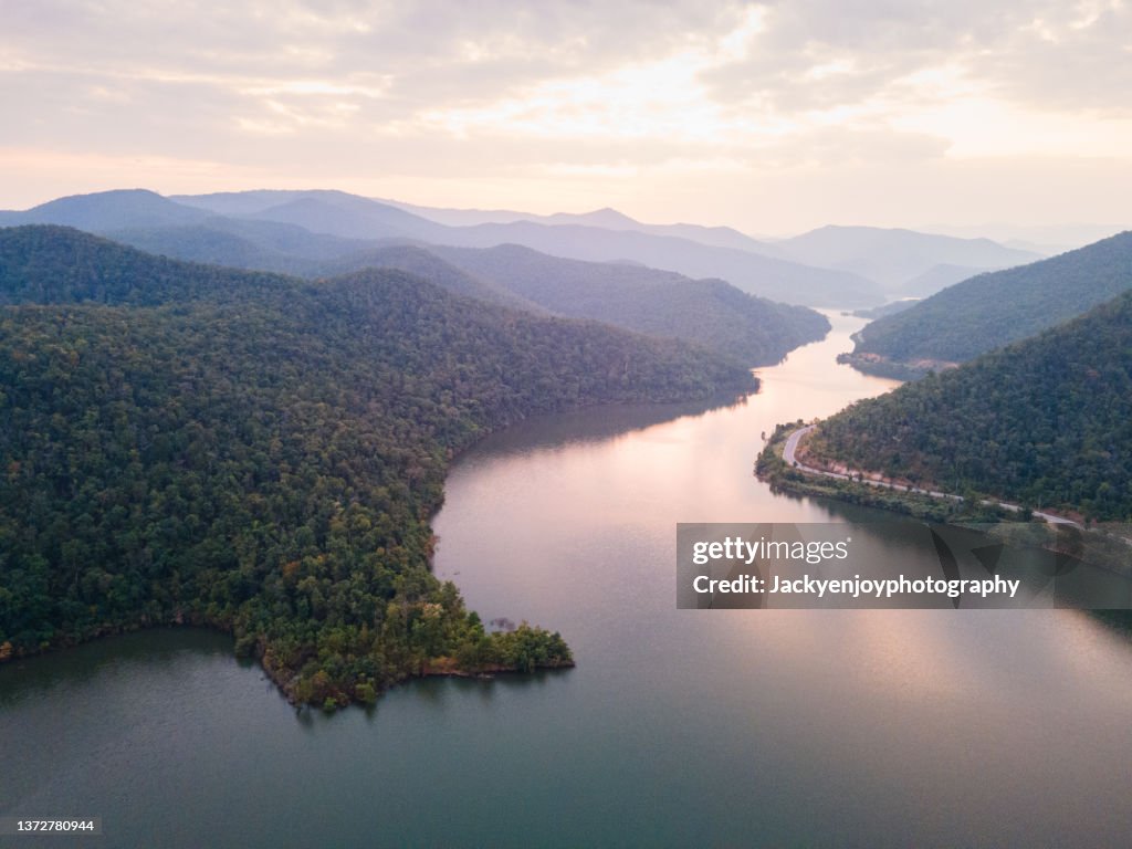 Scenic view Of reservoir and mountains against sky in rural scene Lampang,Thailand