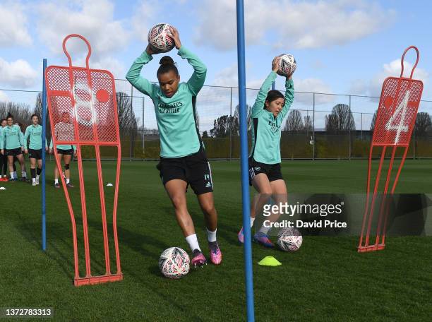 Nikita Parris and Mana Iwabuchi of Arsenal during the Arsenal Women's training session at London Colney on February 25, 2022 in St Albans, England.