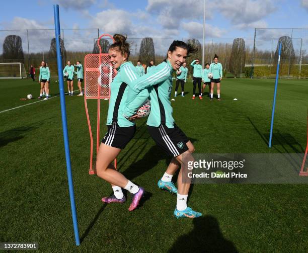 Laura Wienroither and Tobin Heath of Arsenal during the Arsenal Women's training session at London Colney on February 25, 2022 in St Albans, England.