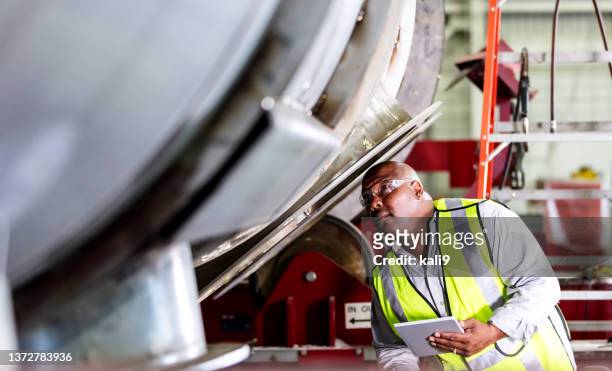 african-american worker in metal fabrication shop - heavy equipment stock pictures, royalty-free photos & images