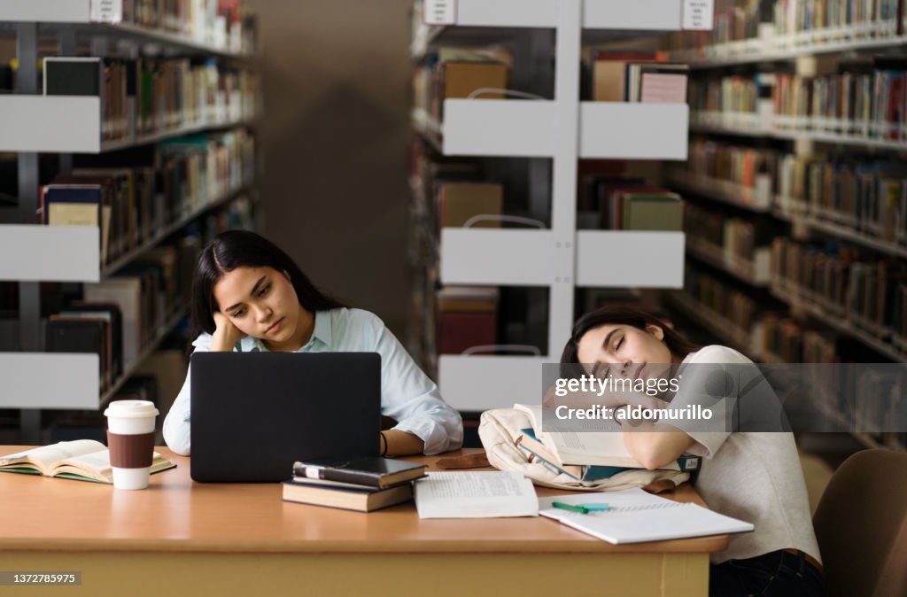 Tired Library Female Student Being Tired At Library High-Res Stock Photo - Getty Images
