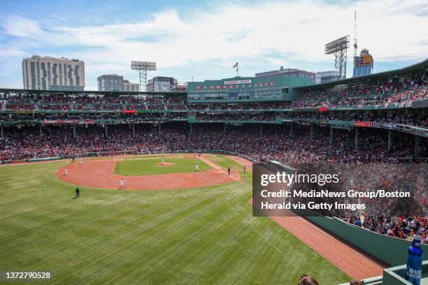 The crowd enjoys the Boston Red Sox opening day game at Fenway Park in Boston on Monday, April 3, 2017. Staff photo by Nicolaus Czarnecki