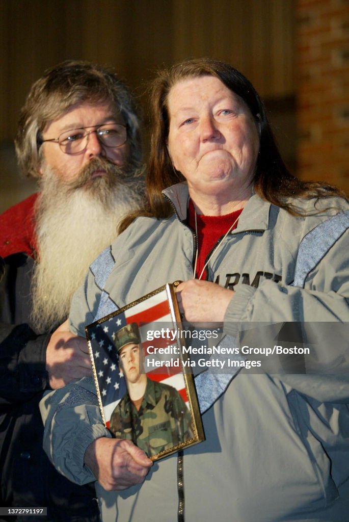 (04/04/2003 - Dracut, MA) Sue holding a picture of her son, Matthew Boule, addresses the media with her husband Leo Boule outside the Dracut Police Station. Matthew Boule who died in combat at age 22. He enlisted on March 19, 2001 and was based at