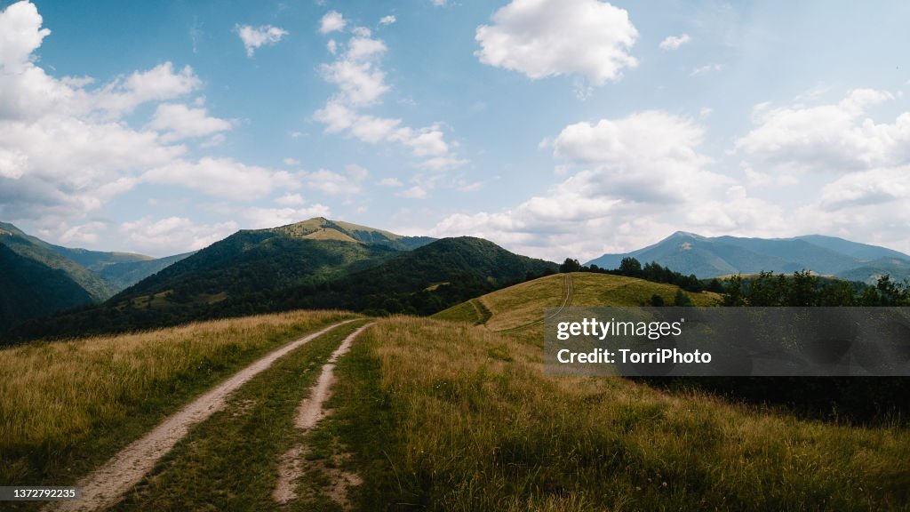Dirty road in mountain valley