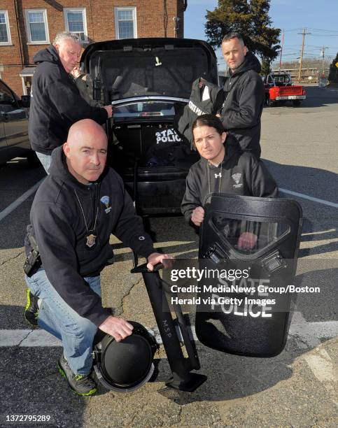 . Mass. State Police Detective Lieutenant ? Michael Farley and members of the state police's Violent Fugitive Apprehension Section at the Framingham...