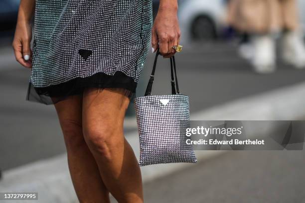 Guest wears a black tulle with embroidered silver rhinestones halter-neck / sleeveless short dress from Prada, a black with embroidered silver...