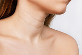 Cropped shot of a young woman with lines on her neck Wrinkles creases agerelated changes