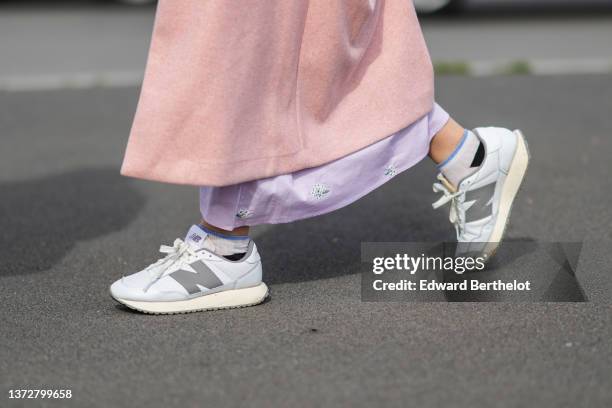 Guest wears a pale purple with green flower print pattern V-neck / cut-out waist midi dress, a pale pink wool long coat, white leather and silver...