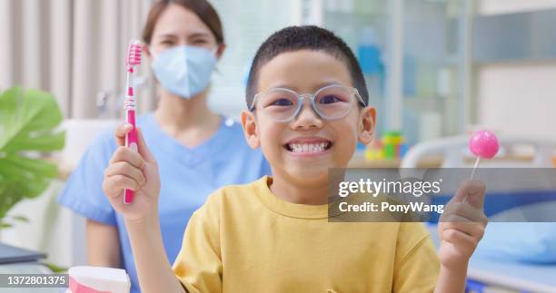 dentist teach about teeth health - candy wang stock pictures, royalty-free photos & images