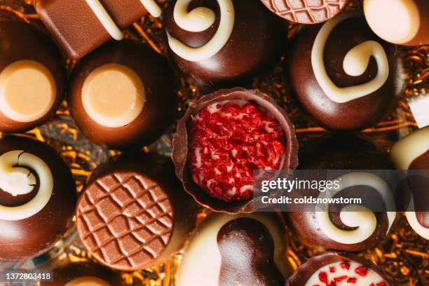 gourmet chocolates selection macro close up - praline stock pictures, royalty-free photos & images