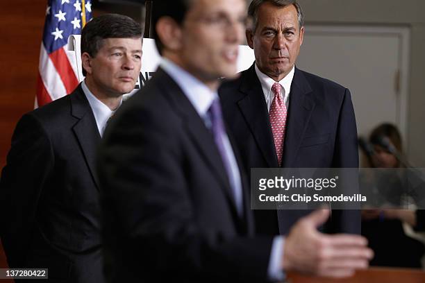 Speaker of the House John Boehner and Rep. Jeb Hensarling listen to House Majority Leader Eric Cantor during a press briefingat the U.S. Capitol...