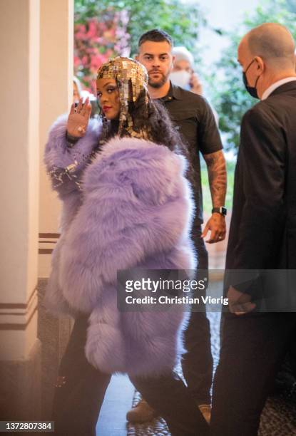 Rihanna is seen wearing golden head piece, pink coat arriving at her hotel after Gucci during the Milan Fashion Week Fall/Winter 2022/2023 on...