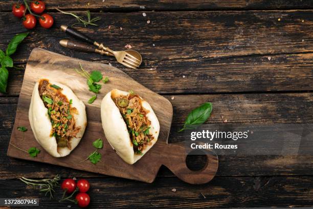 bao buns with pulled pork - hoisin sauce stock pictures, royalty-free photos & images