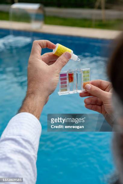 measuring the ph levels in a pool - ph value stock pictures, royalty-free photos & images