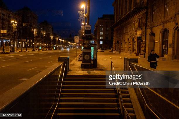 Man walks on an empty street close to Independence Square ahead of the nights curfew on February 25, 2022 in Kyiv, Ukraine. Yesterday, Russia began a...